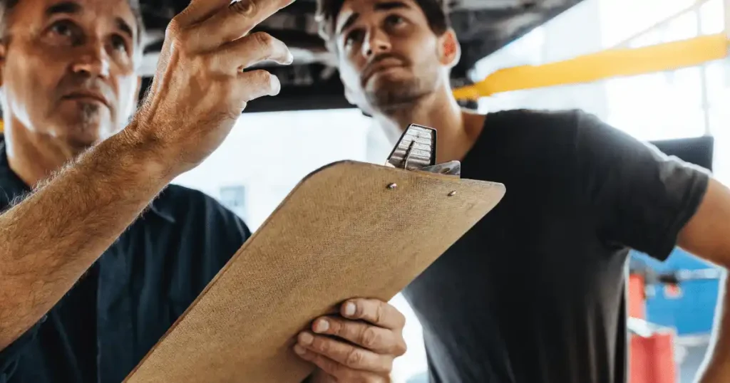 people checking a garage door